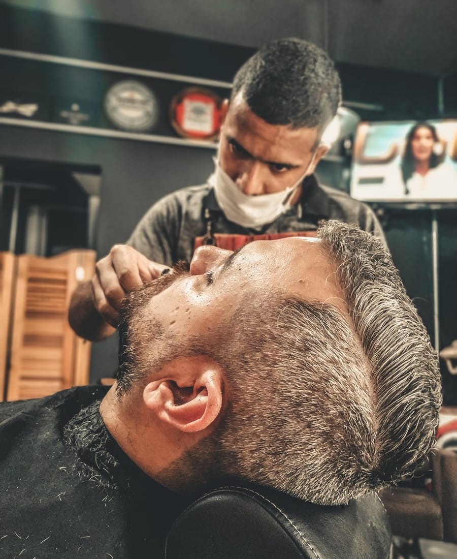 The interior of Blackwood Barbers with classic chairs and a traditional shopfit