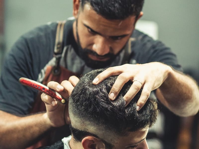 Close-up of a sharp high skin fade with a textured top and crisp line-up